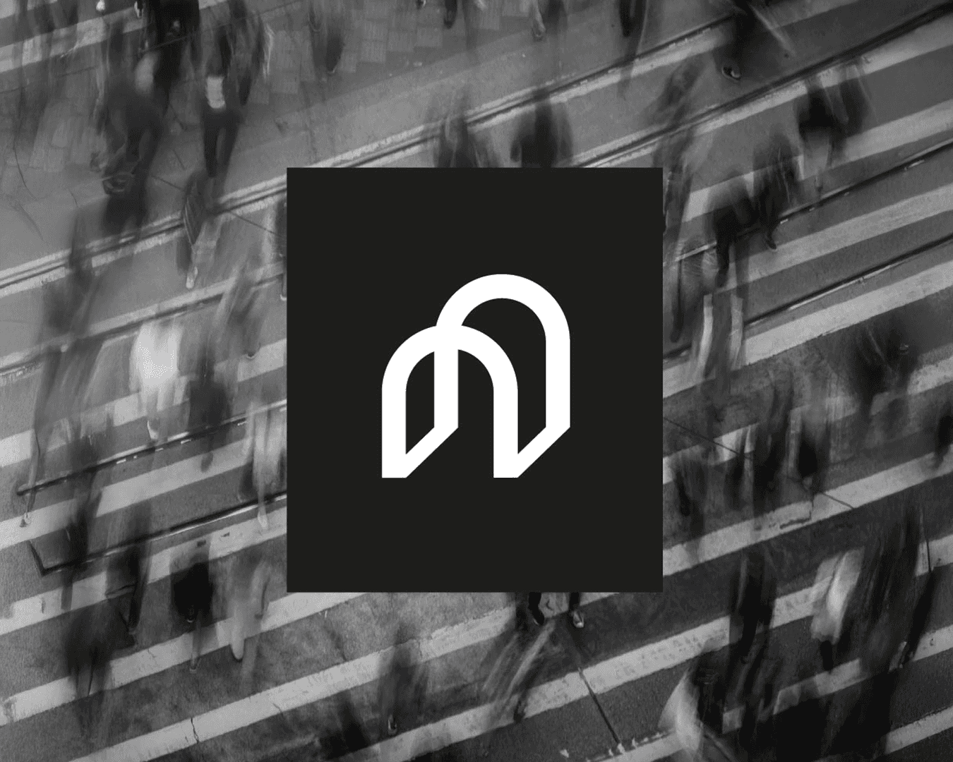 Black-and-white overhead view of a crowd crossing a crosswalk with motion blur, featuring the cream “Policy Lab” monogram on a black square; identity by Studio La Folie.